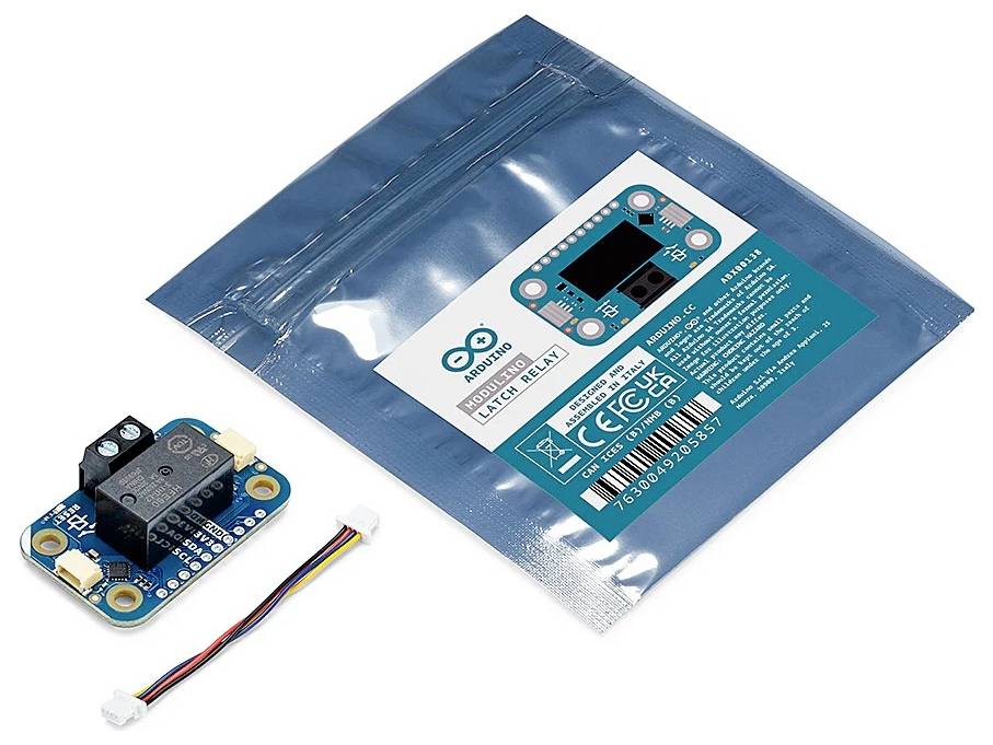 An Arduino relay module with a black relay component, small circuit board, and wires next to a sealed blue packaging with labels.