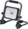 A portable LED work light with a sturdy metal handle and stand, featuring a grid of illuminated LEDs in the center for focused lighting.