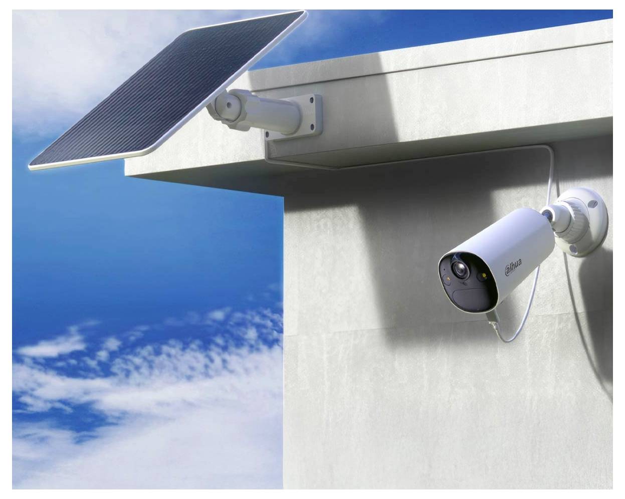 Security camera mounted on a building corner, connected to a solar panel, under a clear blue sky with scattered clouds.