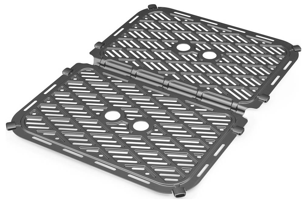 Foldable, rectangular metal grilling grate with diagonal slats and two circular openings in each half, connected by a central hinge.