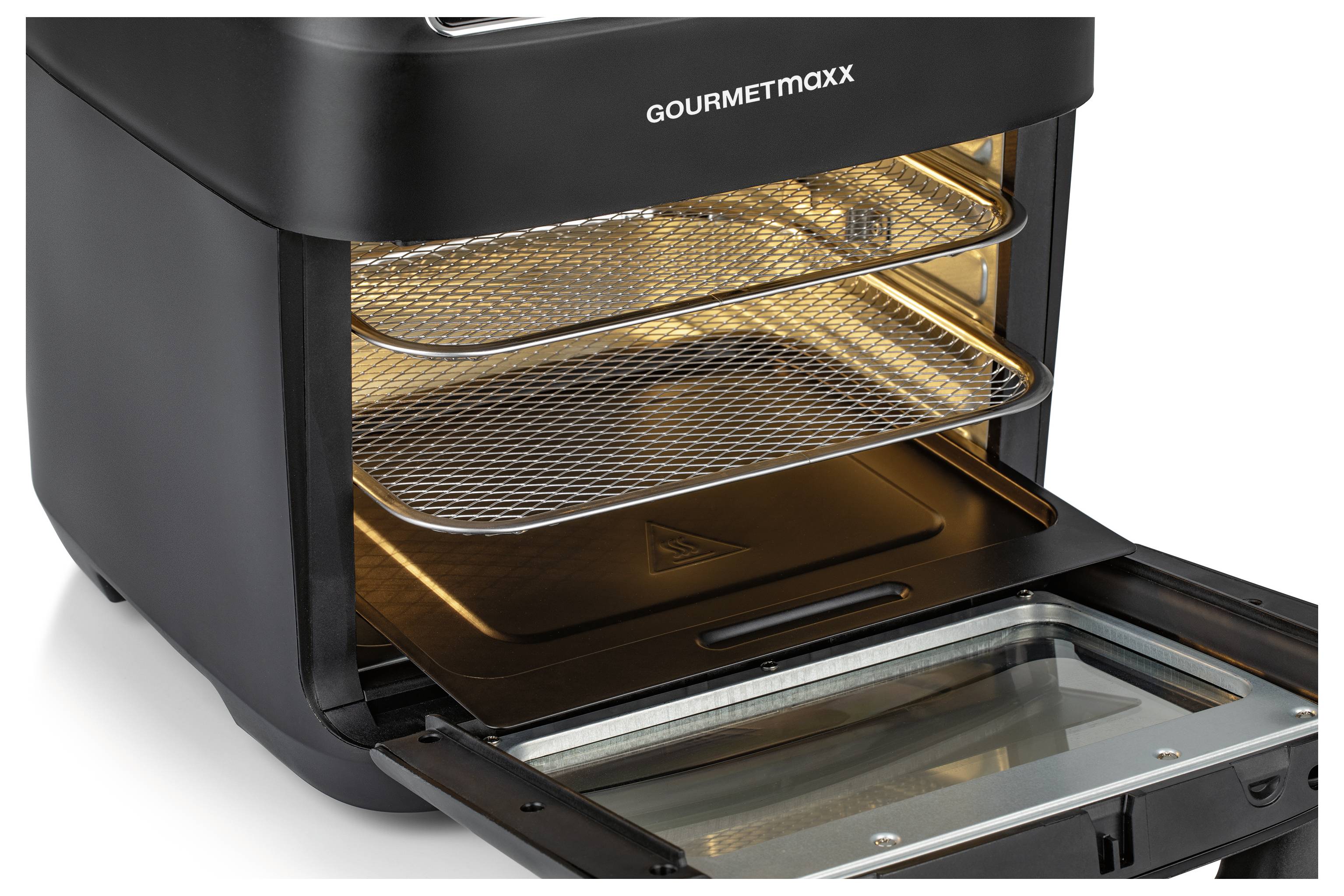 A countertop oven with an open hinged door, showing three wire racks and an interior light illuminating the oven's interior space.