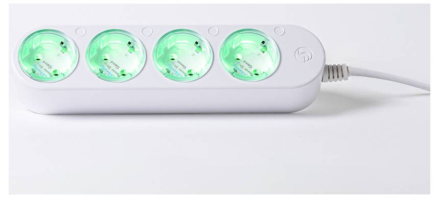 A white power strip with four sockets, each glowing green, connected by a power cord on the right side.