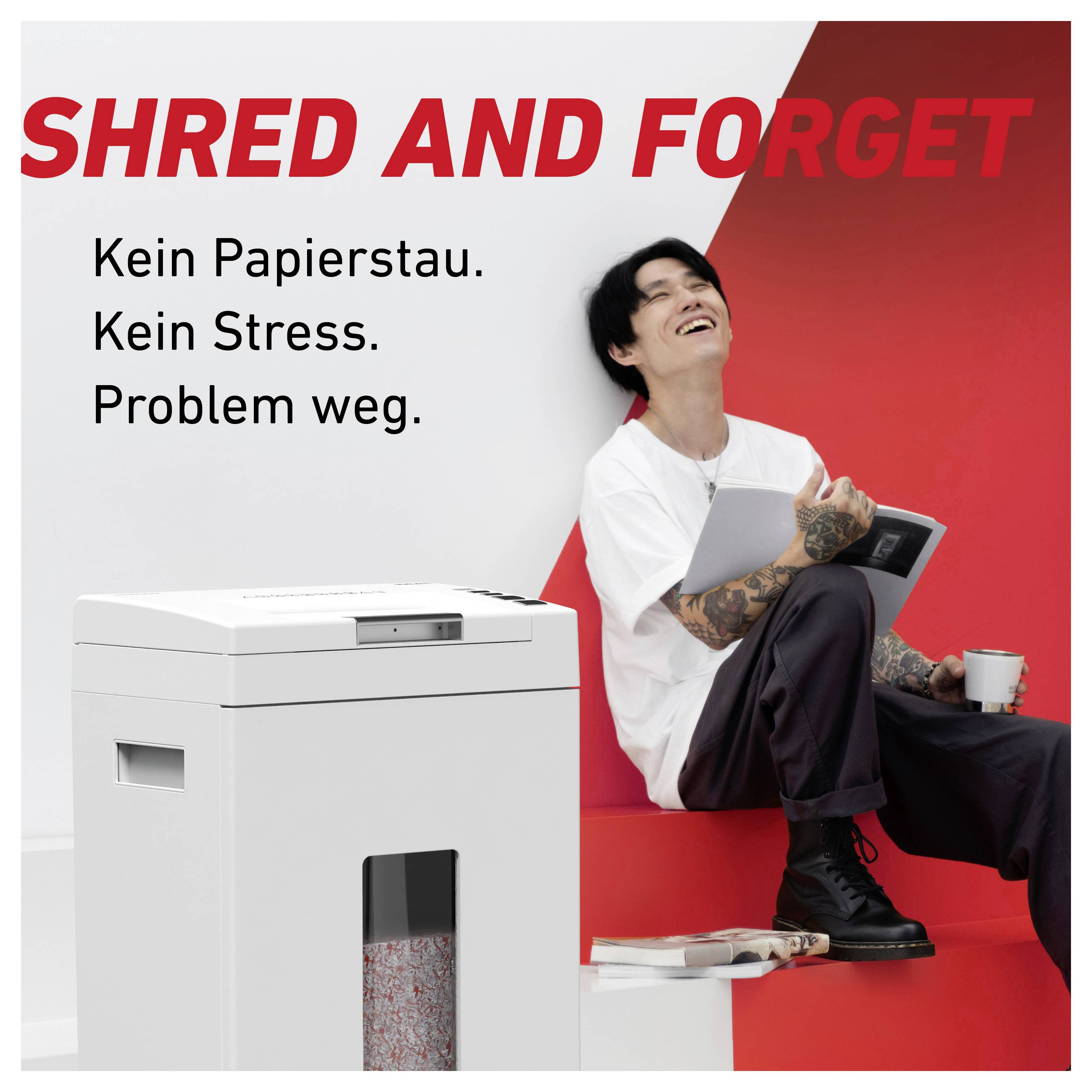 A person sits smiling next to a paper shredder. Text in the image: 'SHRED AND FORGET. No paper jam. No stress. Problem gone.'