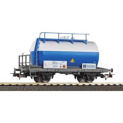 A model railcar features a blue and white cylindrical tanker, marked with safety labels, resting on a section of train track.