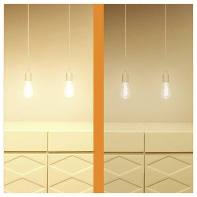 Two light bulbs hang over a beige checkered-patterned surface. The bulb on the right is lit, while the bulb on the left is off.