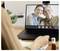 A person participates in a video call with an older man and a woman displayed on a laptop screen. 