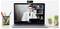 'A doctor in a white coat video conferencing on a laptop, surrounded by office items including plants and a pencil holder.'