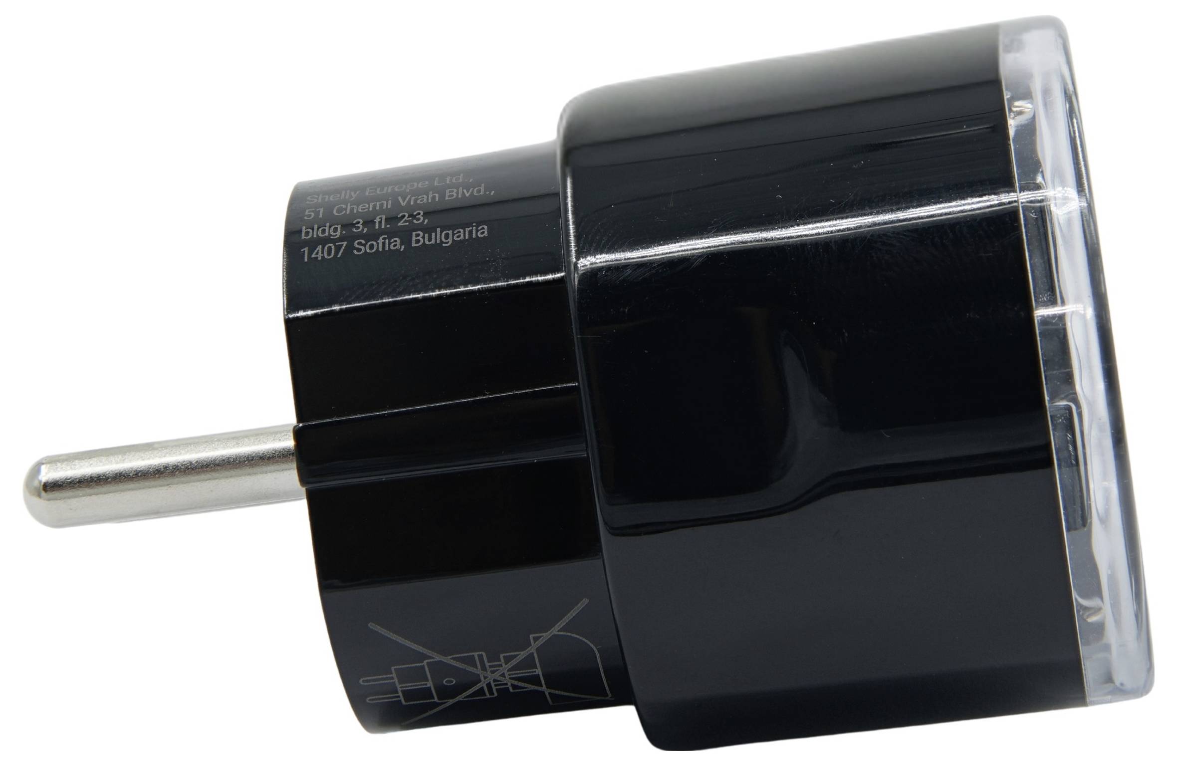 Black electrical plug adapter with transparent section, shown with European plug. Text indicates location: Sofia, Bulgaria.