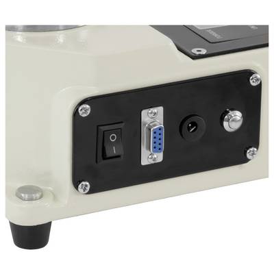 Control panel on a machine showing an on/off rocker switch, blue 9-pin serial port, power jack, and metal knob.<br>