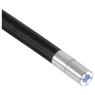 Close-up of a black carbon-fiber flashlight with a silver metal head and lit LED tip on a white background.