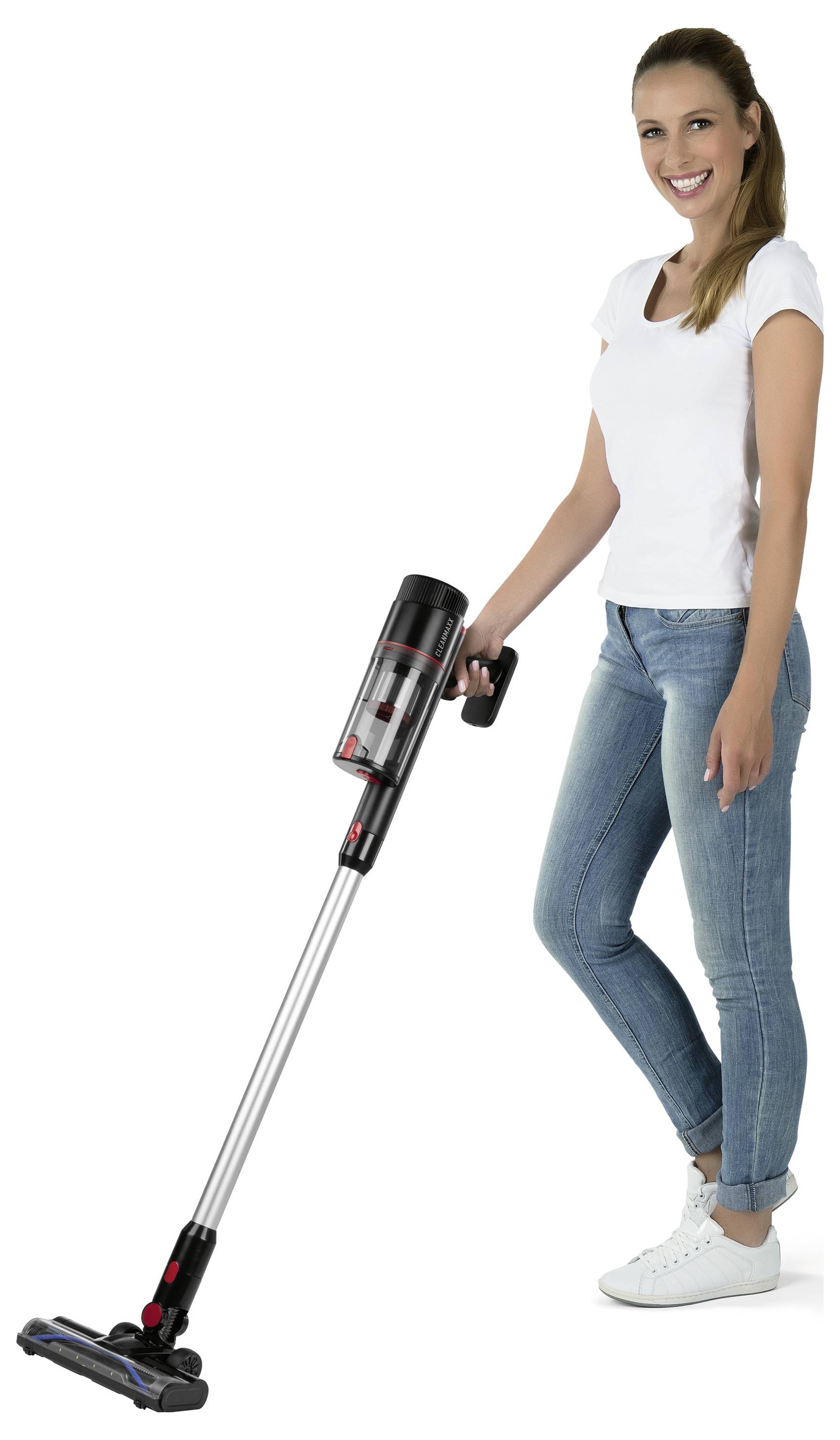 A person smiling while holding a cordless vacuum cleaner, demonstrating its ease of use and lightweight design.