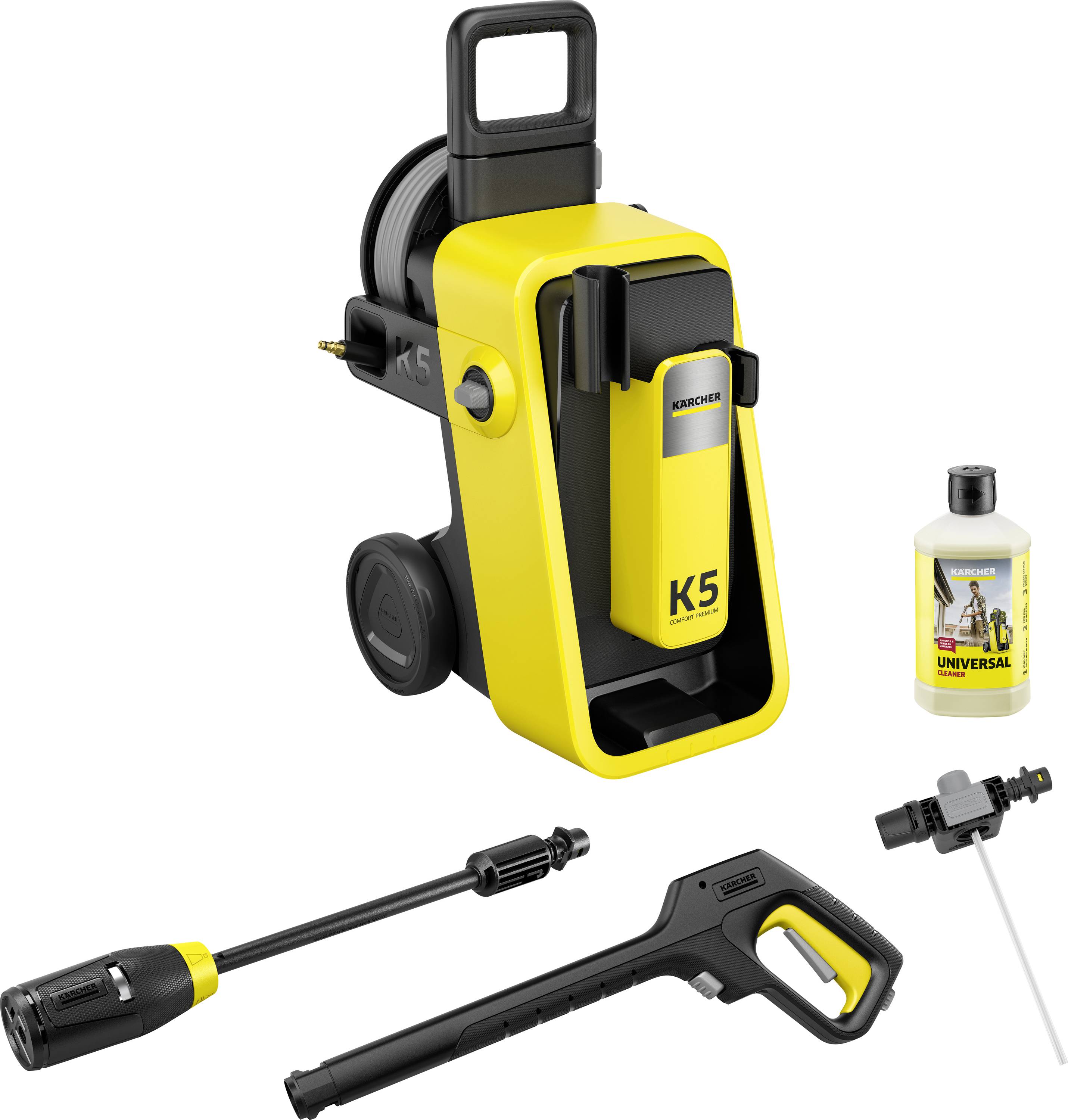 A yellow and black Kärcher K5 pressure washer with wheels, hose, spray gun, detergent bottle, and nozzle attachments, displayed against a white background.