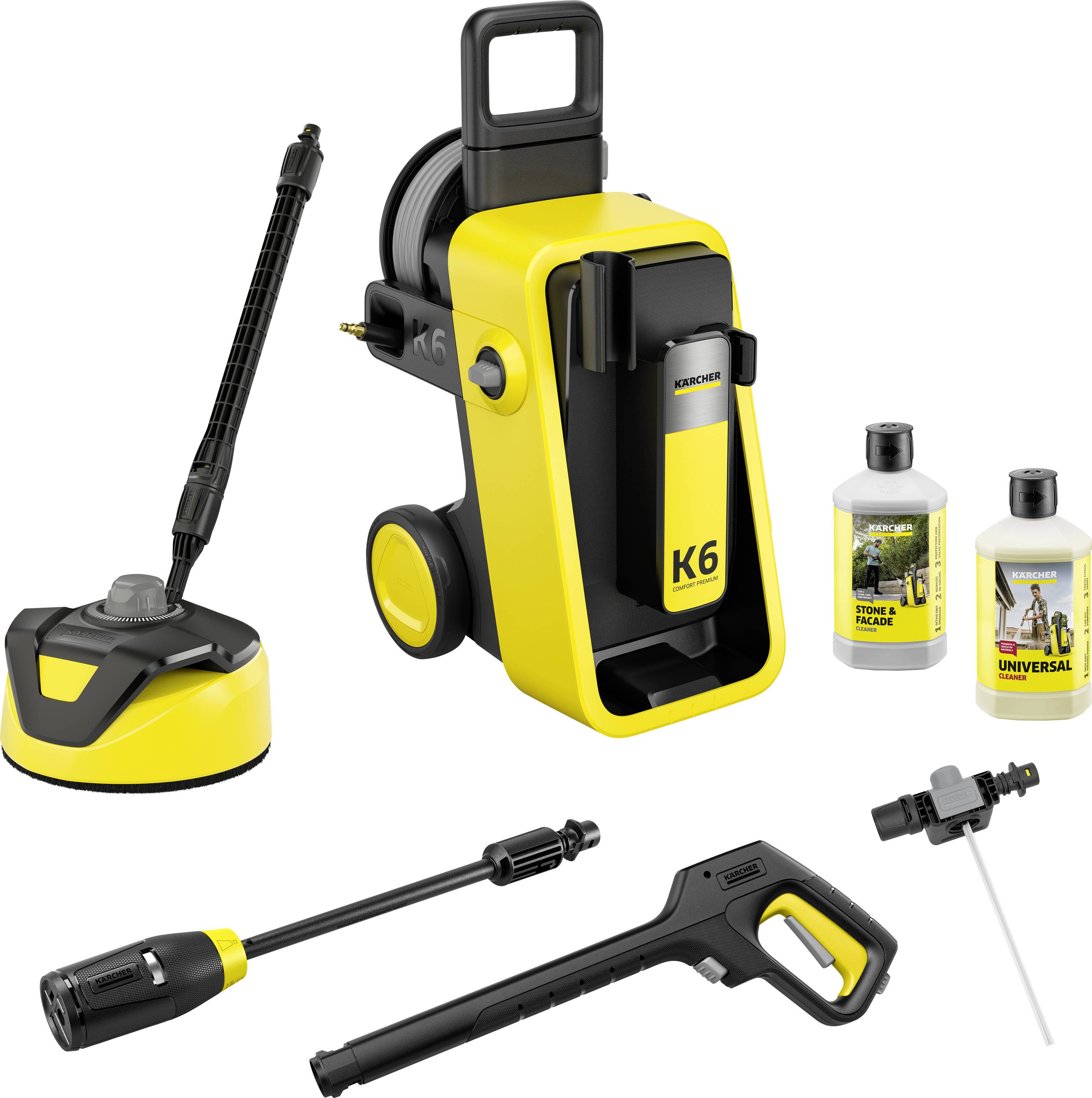 A yellow and black pressure washer with wheels, labeled 'K6', includes a hose reel, various nozzles, and two bottles of cleaning solution.