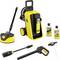 A yellow and black pressure washer with wheels, labeled 'K6', includes a hose reel, various nozzles, and two bottles of cleaning solution.