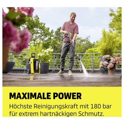 Man cleaning terrace with pressure washer; advertising text: 'MAXIMUM POWER' and 'Highest cleaning force with 180 bar for extremely stubborn dirt.'