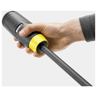 A hand tightly grips a cylindrical black and yellow tool with a nozzle extending from one end, likely used for cleaning or spraying.