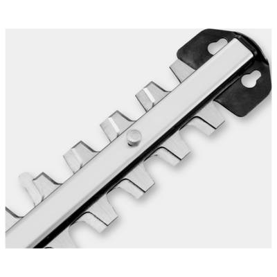 A close-up of a metal hedge trimmer blade with sharp teeth, designed for cutting and trimming plants in garden maintenance.