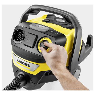 'Hand adjusting the power dial on a Kärcher vacuum cleaner, showcasing the control panel with yellow and black design.'
