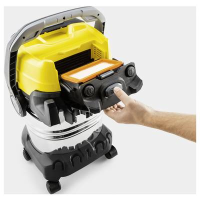 A hand replaces a filter in a yellow and black shop vacuum cleaner, highlighting the ease of maintenance of the device.