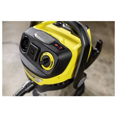 A close-up of a yellow and black vacuum cleaner control panel featuring a power switch and varying suction strength settings.