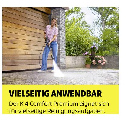 Woman cleaning a courtyard in front of a garage with a high-pressure cleaner; Text: 'VERSATILE APPLICATION' and 'The K 4 Comfort Premium is suitable for a wide variety of cleaning tasks.'