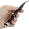 A hand holding a black precision tool with a curved tip, marked 'T2081'. The tool is cylindrical with a metal clip near one end.