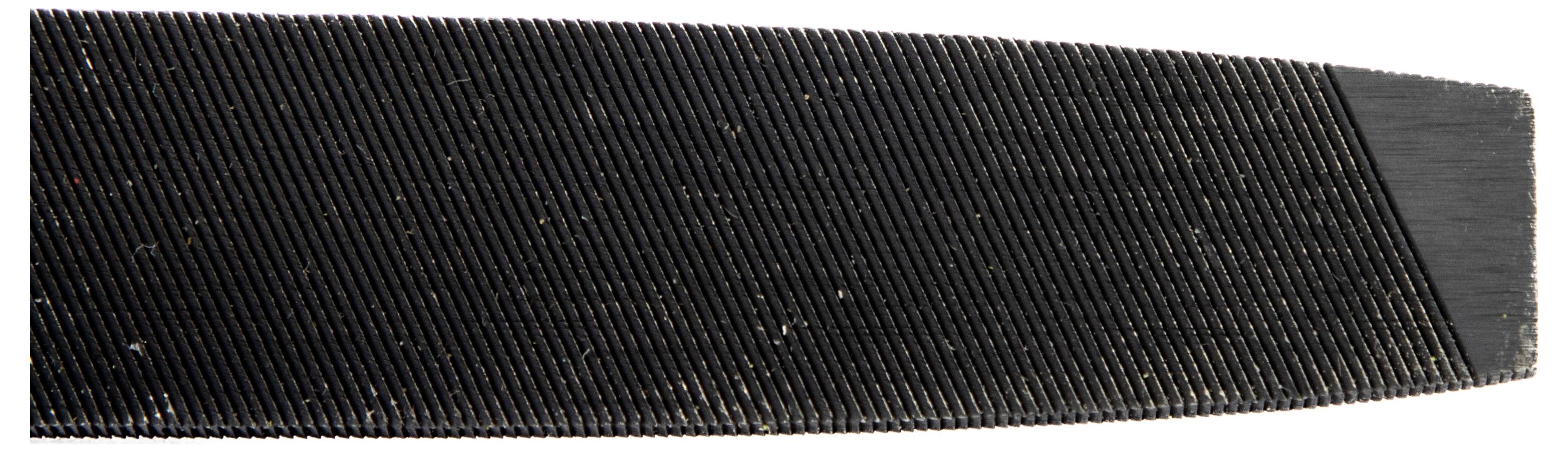 Close-up of a metal file showing fine, parallel grooves used for smoothing or shaping materials.