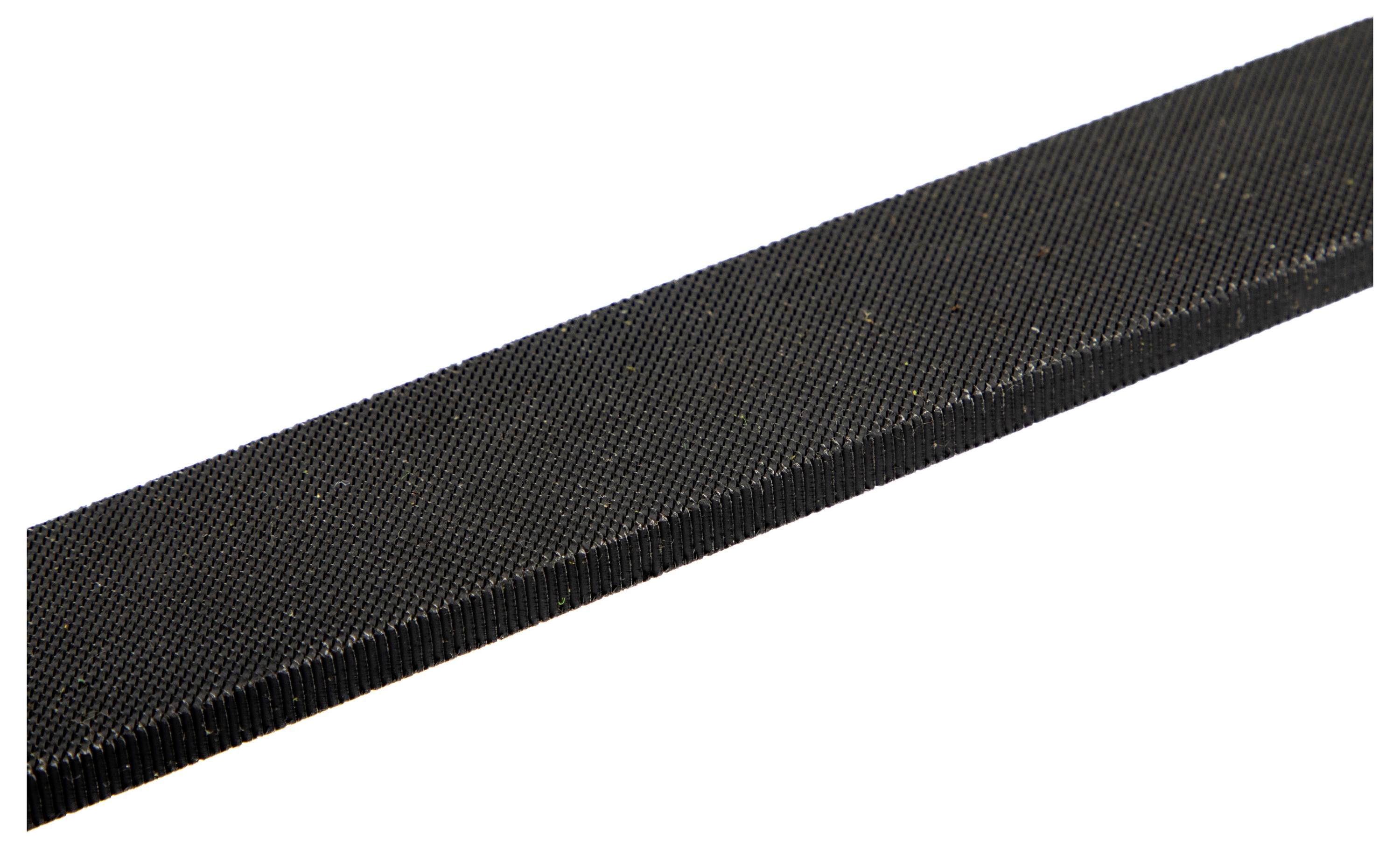 A close-up of a black, rectangular, textured bar with a fine grid-like surface, possibly a file or sanding block.