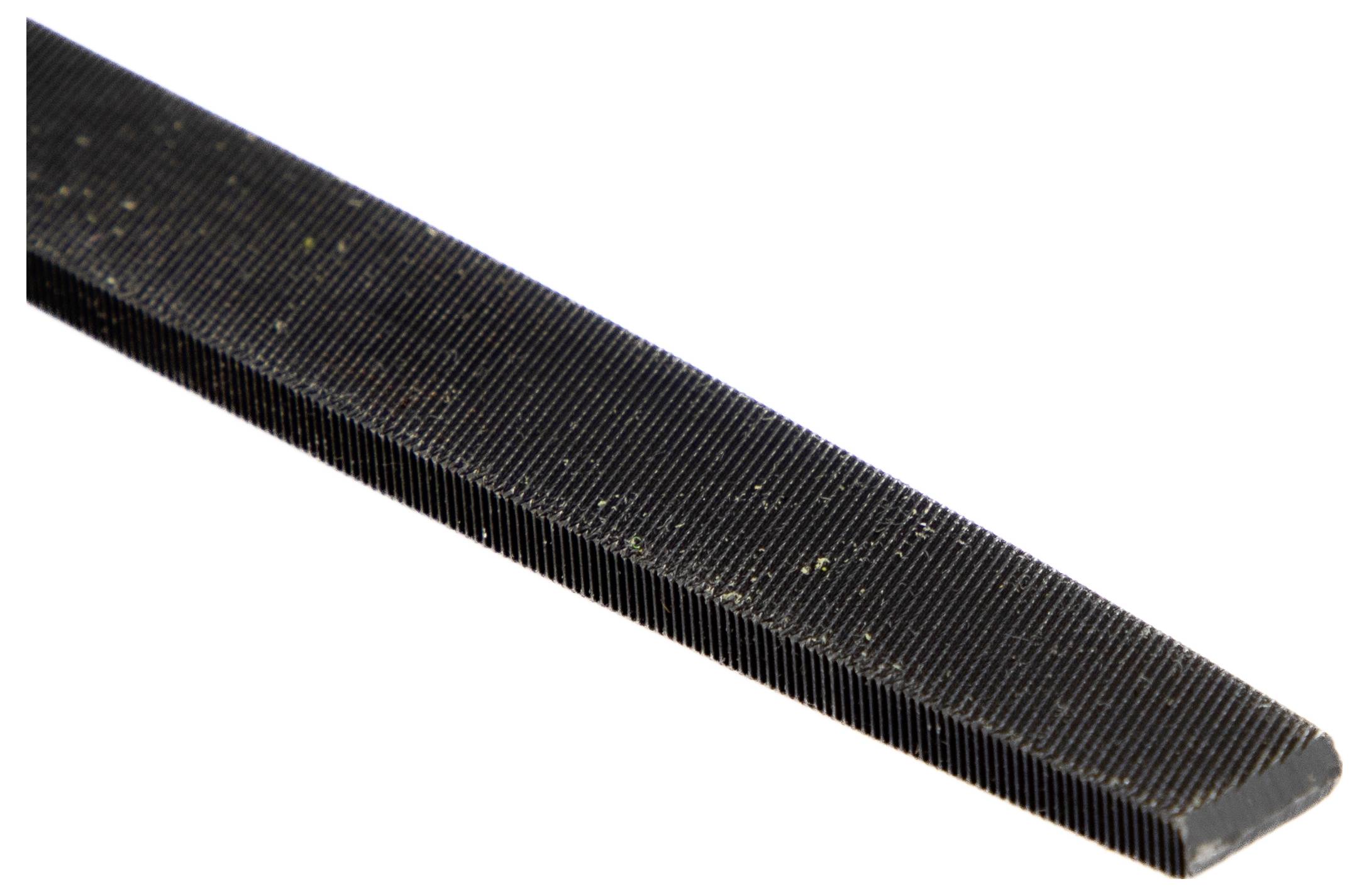 A close-up of a metal file showing its fine, parallel ridges used for smoothing surfaces.