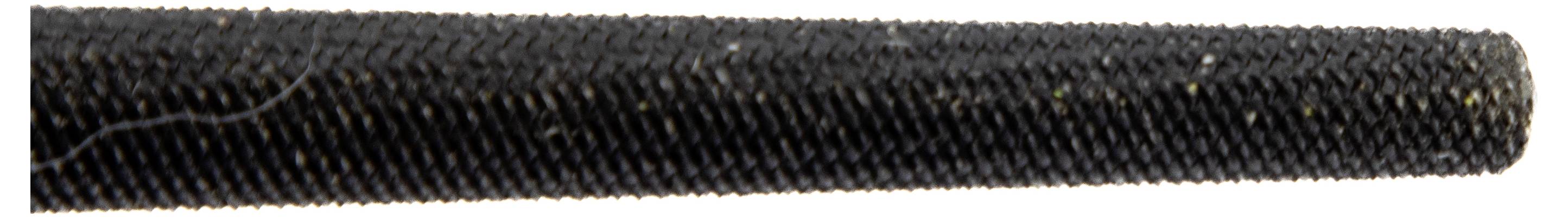 A close-up of a black textured rod, potentially a metal file, showing detailed grooves for filing or smoothing surfaces.