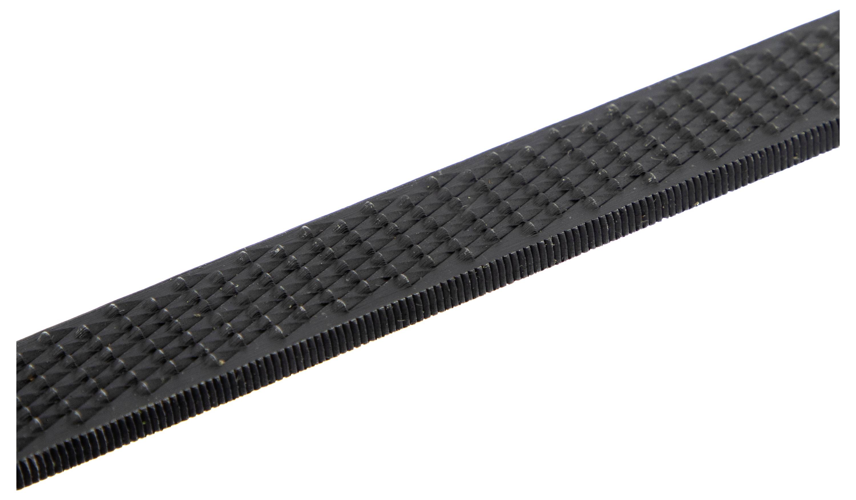 Close-up view of a flat, textured metal file with fine, parallel ridges, designed for smoothing or shaping surfaces in metalworking or woodworking.