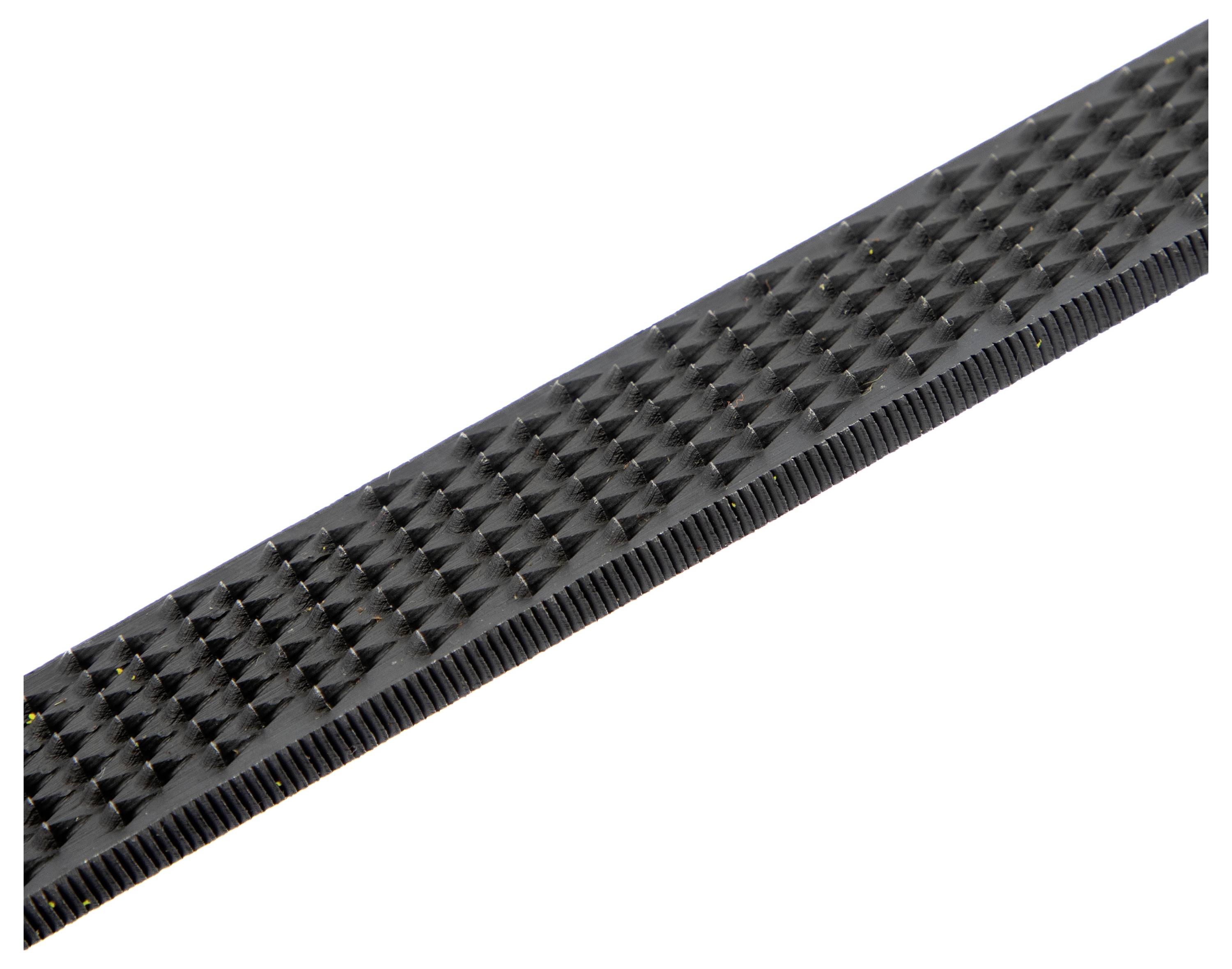 A black, textured rectangular object with a ridged pattern, possibly a belt or strap, extending in a diagonal orientation.