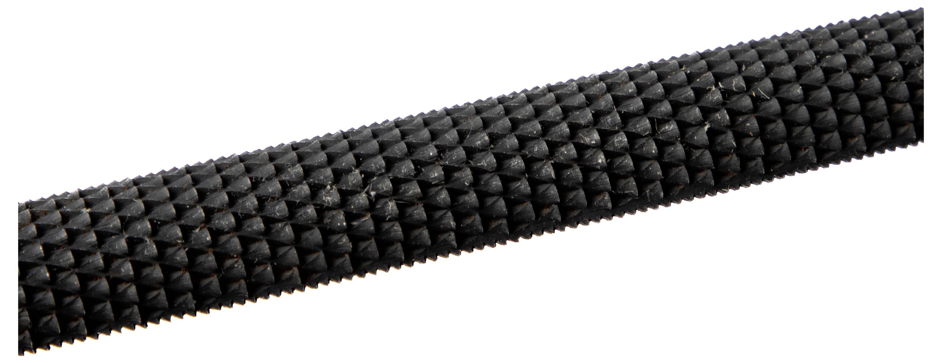 'A close-up of a textured, black cylindrical tool handle featuring a triangular grip pattern.'