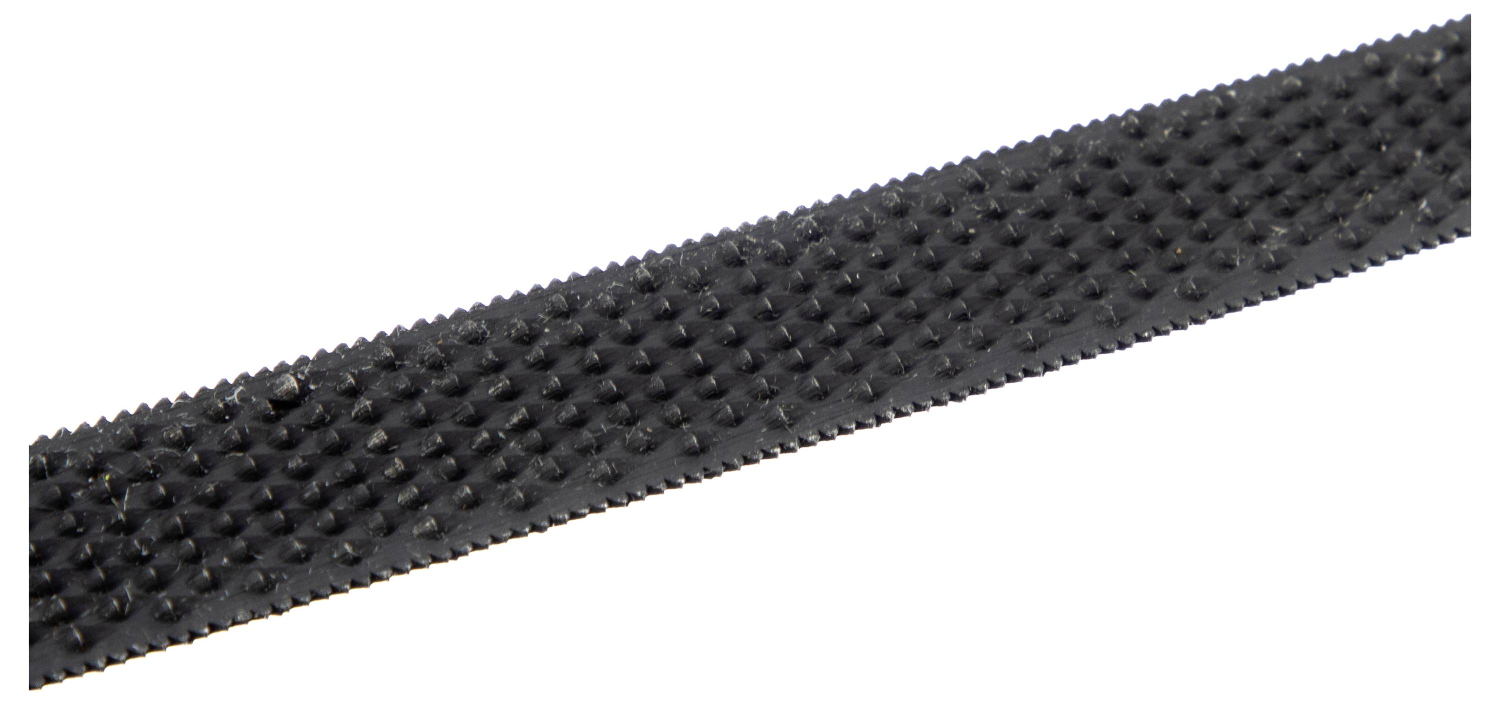 A close-up view of a black, textured strip with small raised dots, possibly a grip or traction material.