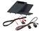 Wireless charging pad with installation wiring harnesses and connectors displayed below it.<br>