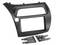 Black plastic car stereo dash installation kit with rectangular radio opening and mounting brackets<br>