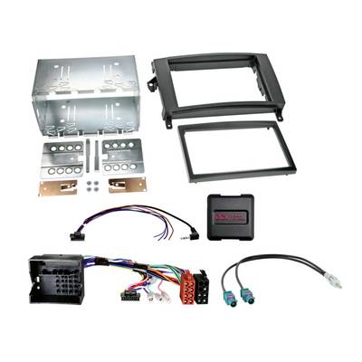 Car stereo installation kit with metal mounting brackets, trim frames, wiring harnesses, adapters, and a control module laid out on a white background.