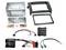 Car stereo installation kit with metal mounting brackets, trim frames, wiring harnesses, adapters, and a control module laid out on a white background.