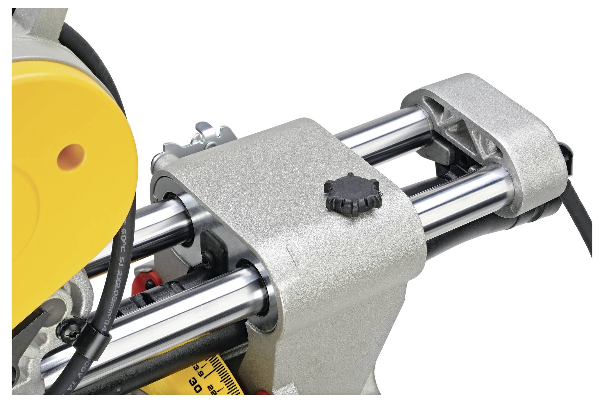 Close-up of a metal power tool component with cylindrical rods and a black adjustment knob, likely part of a sawing machine.