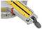 Close-up of a miter saw angle adjustment mechanism highlighted in yellow with a red lever, showing detailed measurement markings.