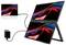 Dual portable monitors connected by cable to a laptop/tablet, showing the same abstract red and blue wave display on each screen.