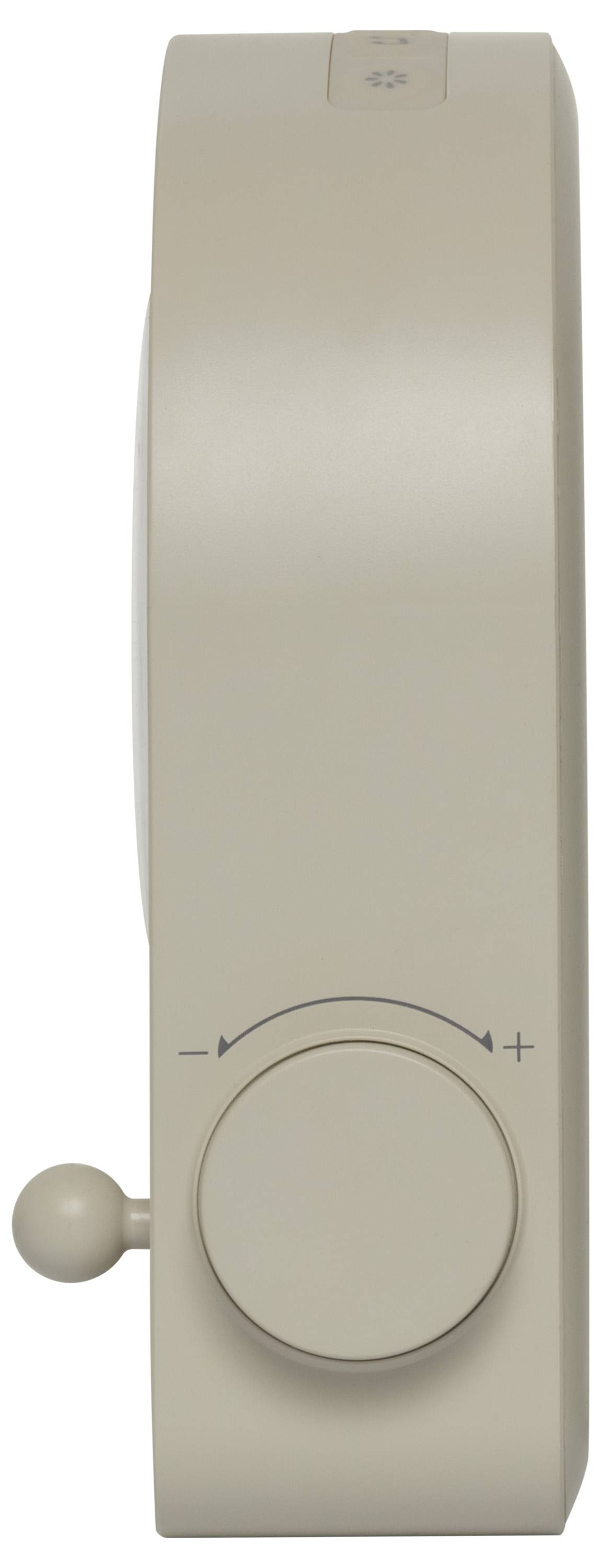 A beige rectangular object with a round dial and a small lever on the side, likely a volume control, viewed from the side.