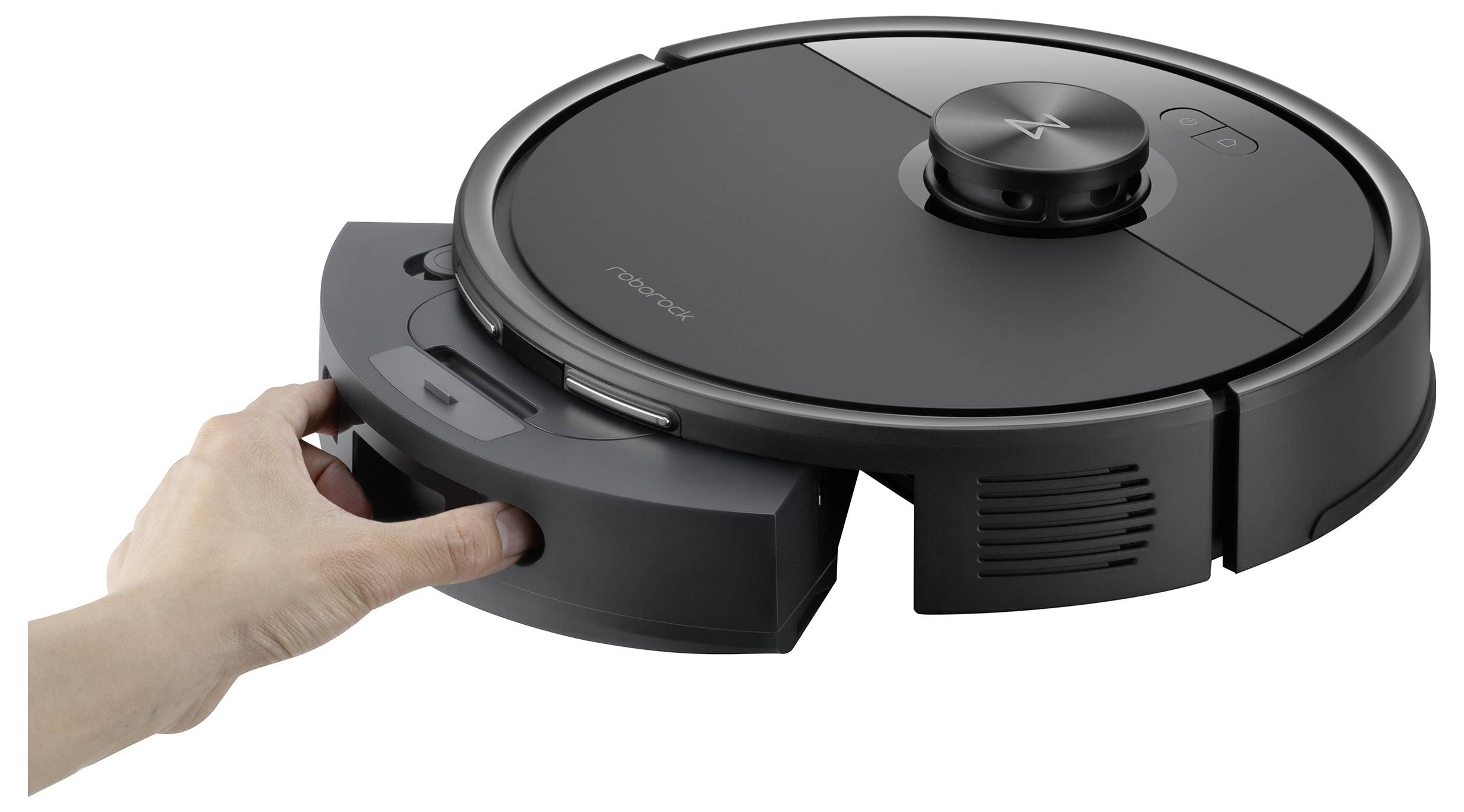 A person inserts a dustbin into a sleek, circular robotic vacuum cleaner.