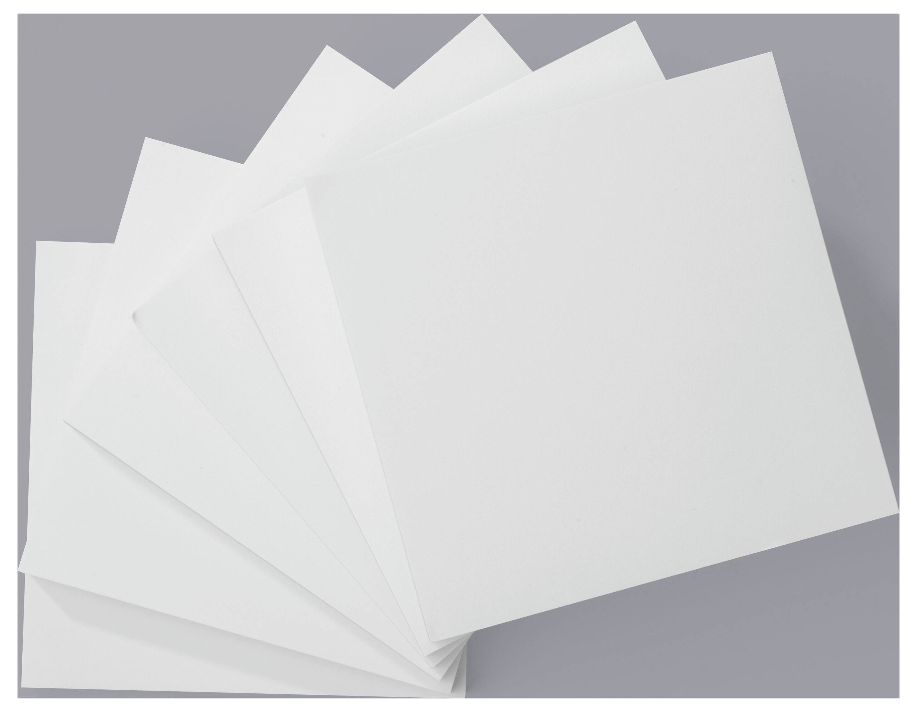 Five overlapping blank white sheets are fanned out against a gray background.