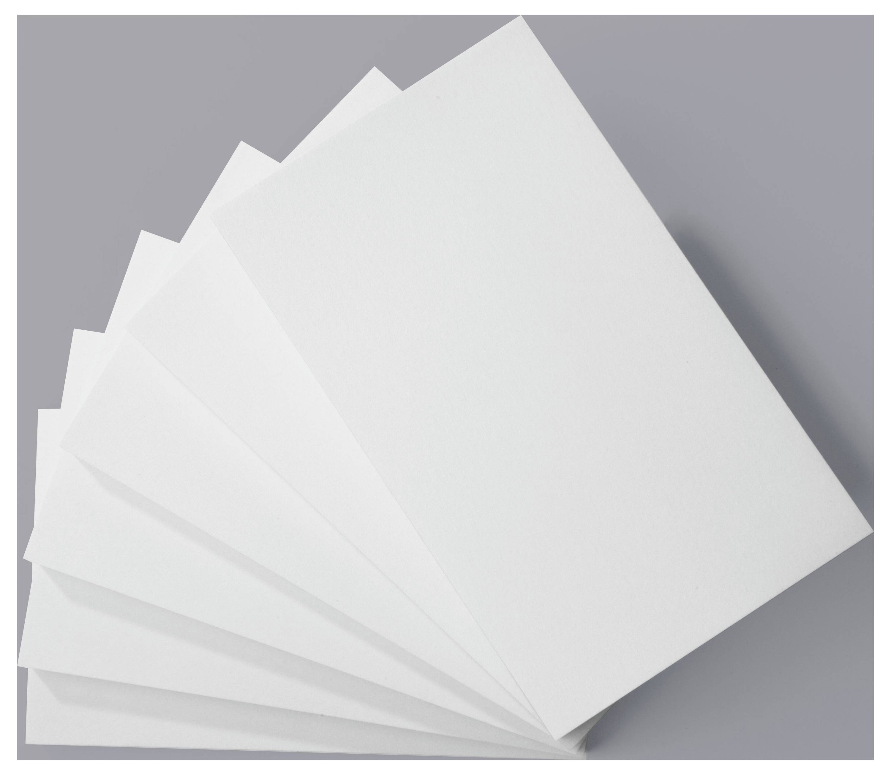 Six overlapping sheets of white paper fanned out against a gray background.