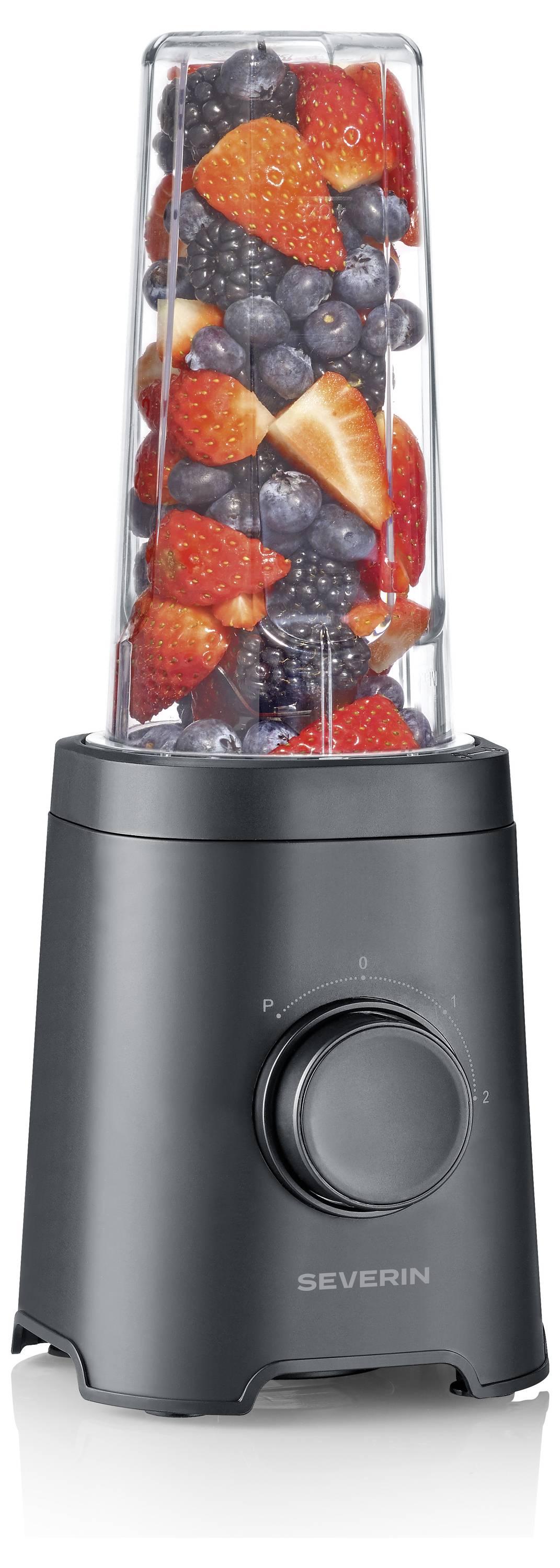 A black blender with a transparent container filled with strawberries, blueberries, and blackberries, ready for blending.
