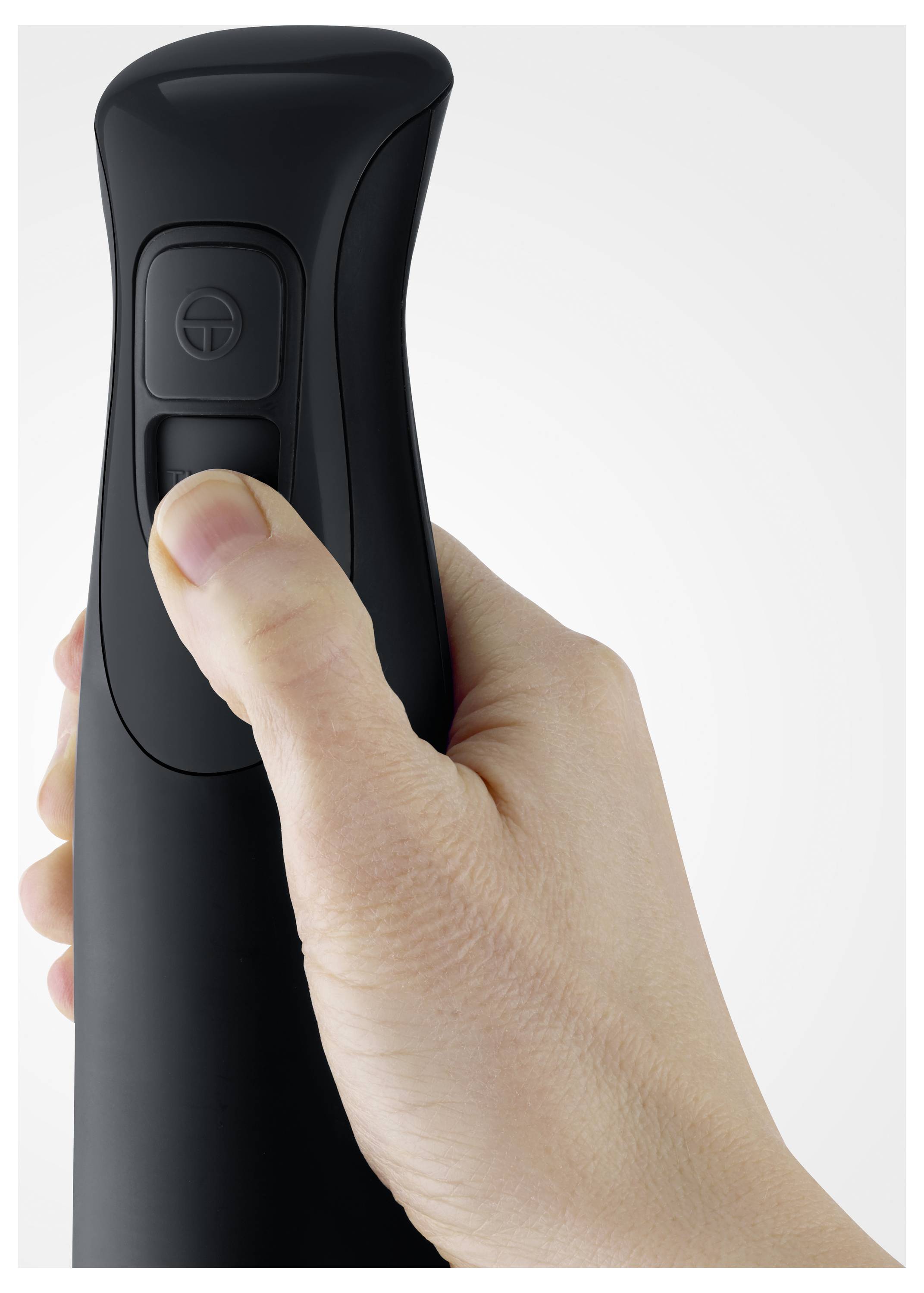 A hand grips a black bottle with a pump nozzle, thumb resting on the button, ready to press.
