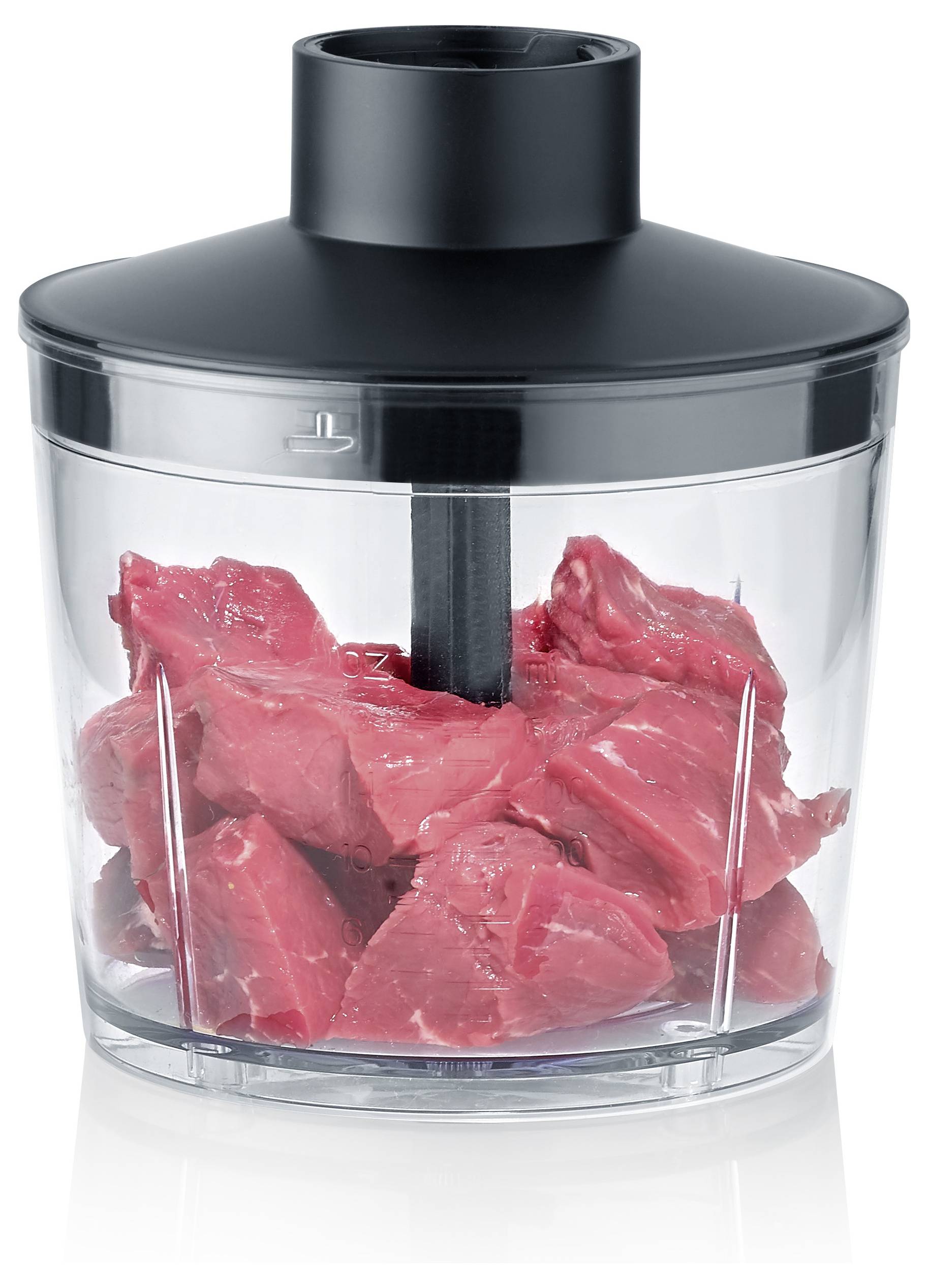 A clear food processor bowl filled with raw chunks of red meat, ready for processing. The lid is black and securely attached.
