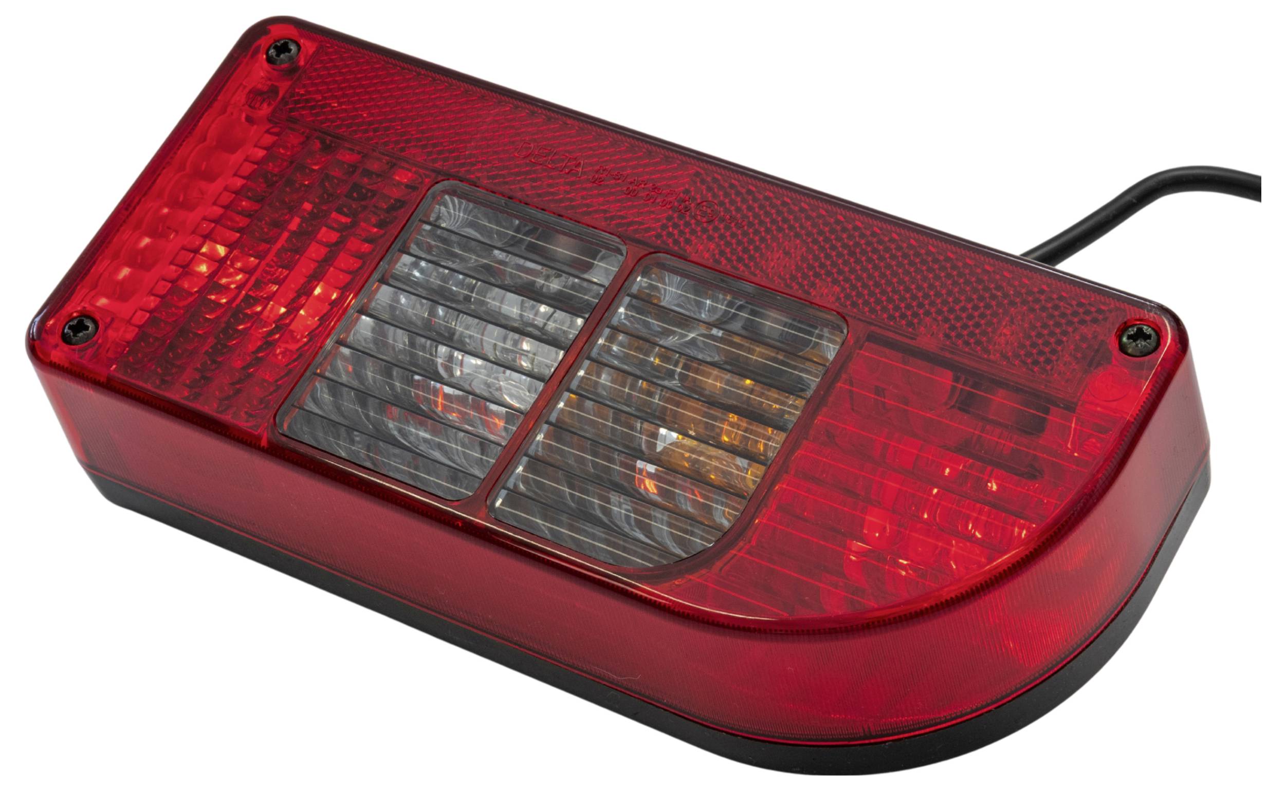 A rectangular, red vehicle tail light with two protective covers, one red and one clear, housing bulbs for brake and signal indicators.