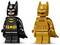 Two Lego figures of a superhero, one in black and the other in gold, both wearing capes and displaying a bat emblem on their chests.